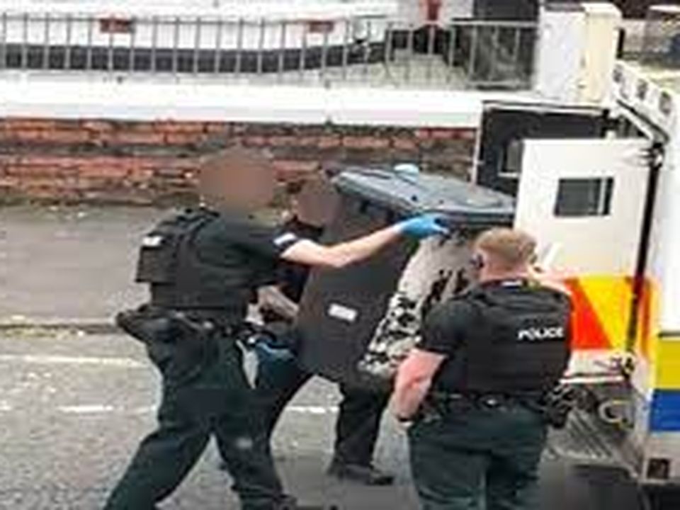 Image of the bin being confiscated by the PSNI