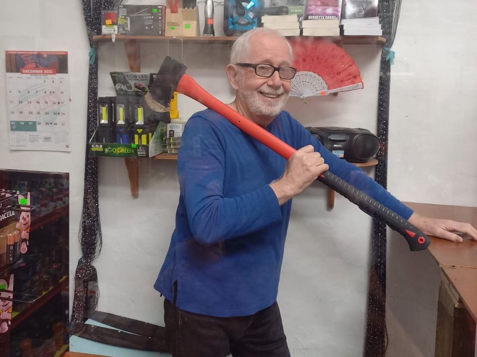 Michael at his shop in Bermuda with the axe