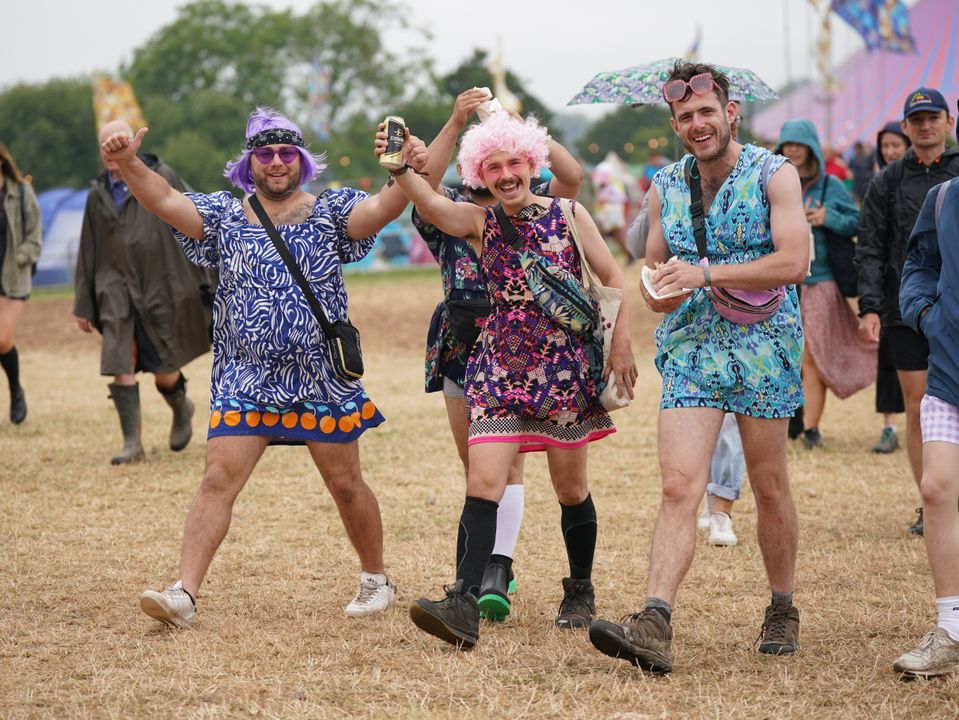 Floral dresses and sensible footwear was the dress code for these festival-goers out to enjoy themselves (Yui Mok/PA)