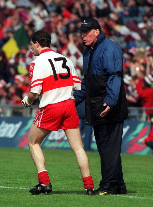 Derry manager Brian Mullins in conversation with Joe Brolly. Photo: David Maher/Sportsfile
