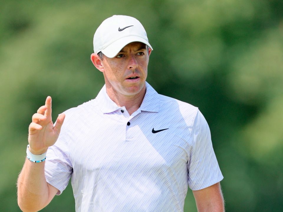 Rory McIlroy reacts to his birdie putt on the sixth green