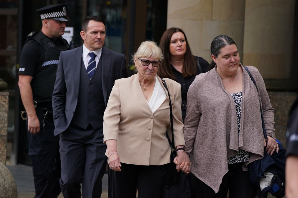 Tony Parsons’s widow Margaret leaves court with their children Mike and Victoria, right (Andrew Milligan/PA)