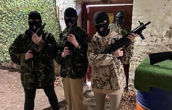Masked guests at the venue's airsoft range