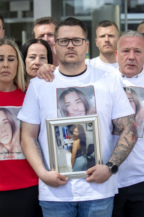 David Poole holds a framed photo of his murdered sister, Jennie, as her family and friends gathered outside the Central Criminal Court. Photo: Collins Courts