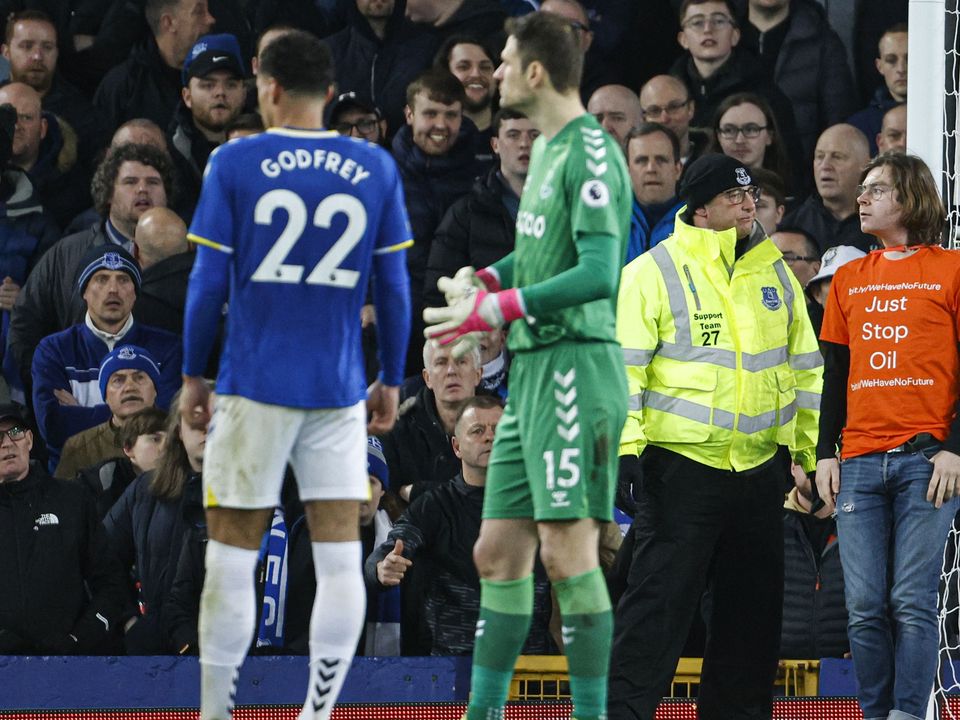 A protester tied himself to a goalpost during Everton’s win over Newcastle (Richard Sellers/PA).