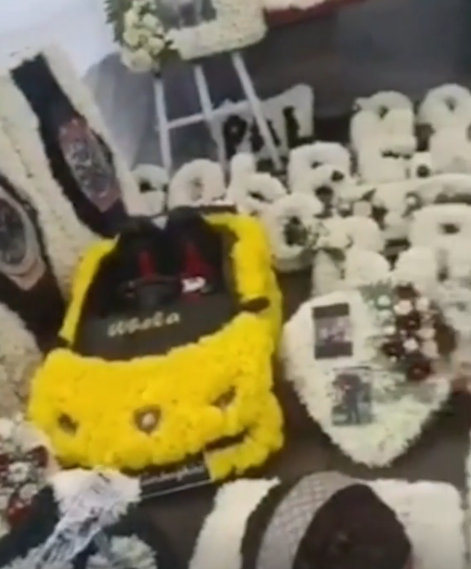 The floral arrangements featured a Lamborghini car and watches