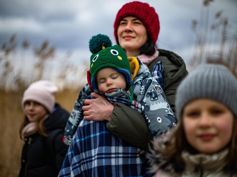 Refugee Olena Savkova with her children Ellie (10) Kristie (7) and Misha (10 months) from the cityh of Dnipro in Ukraine who crossed the border to Poland (Photo: Mark Condren)