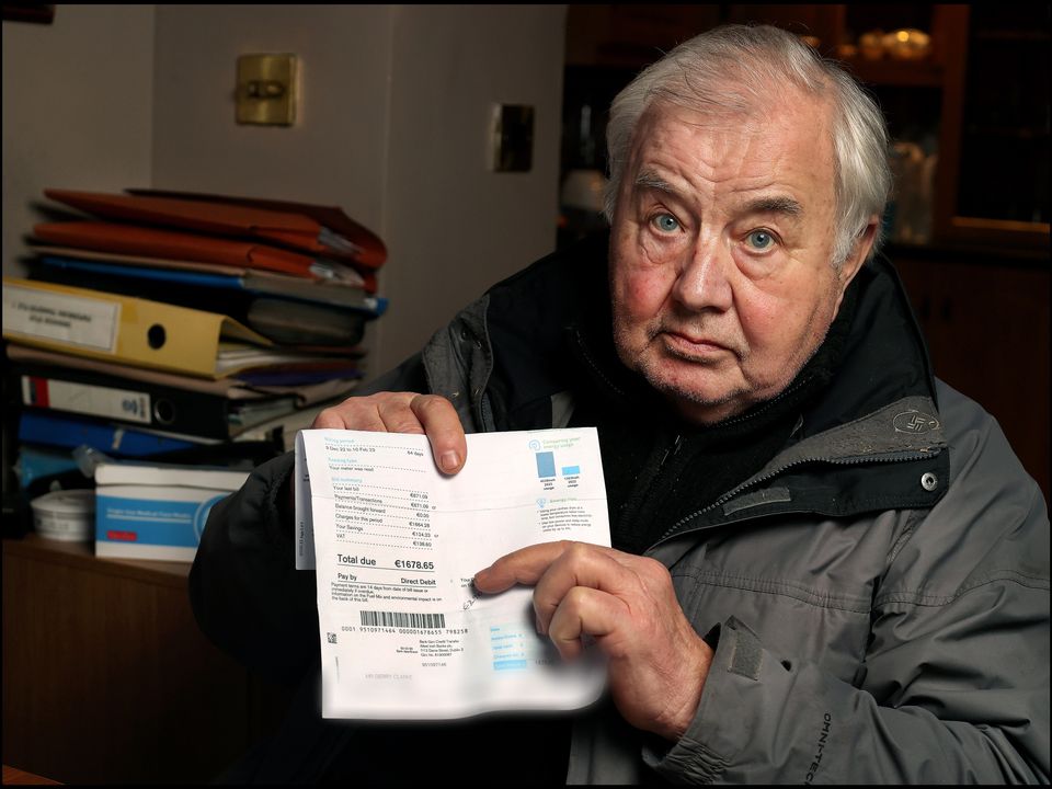 Gerry Clarke at home in Co Meath with his most recent bill from Electric Ireland. Photo: Steve Humphreys