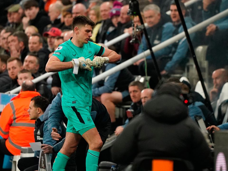 Newcastle United goalkeeper Nick Pope leaves the pitch after being being shown a red card. Photo: Owen Humphreys/PA
