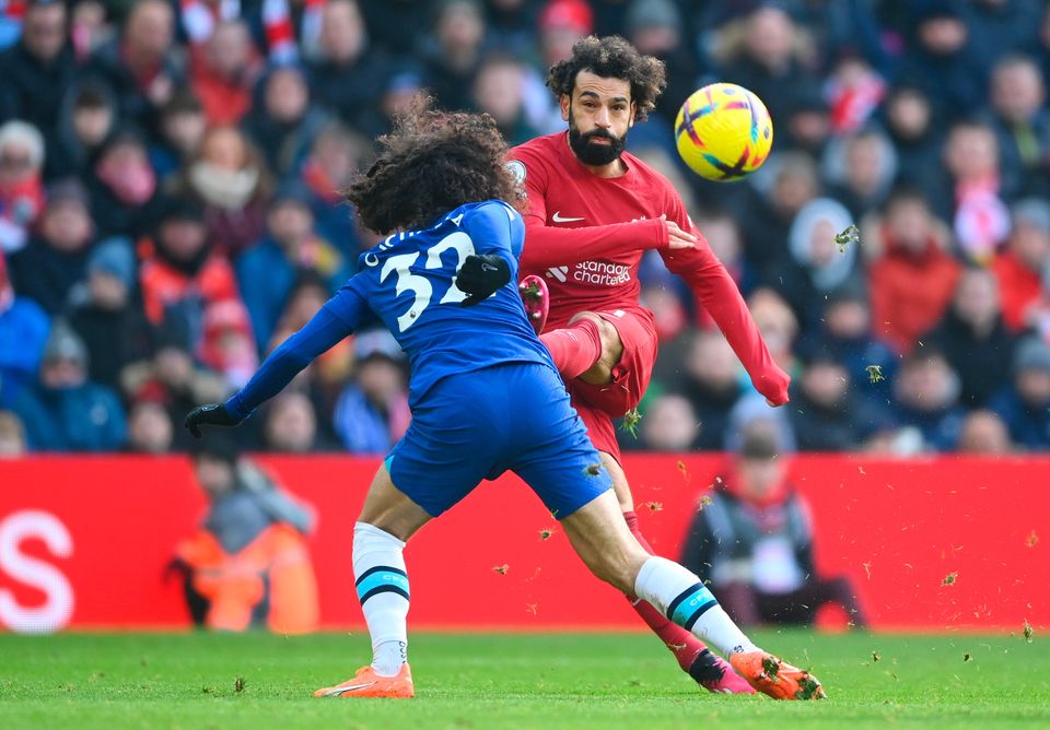 LIVERPOOL, ENGLAND - JANUARY 21: Mohamed Salah of Liverpool shoots past Marc Cucurella of Chelsea during the Premier League match between Liverpool FC and Chelsea FC at Anfield on January 21, 2023 in Liverpool, England. (Photo by Laurence Griffiths/Getty Images)