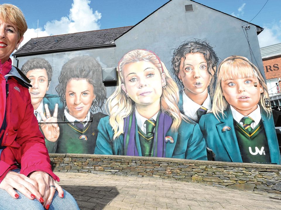 Karen Henderson of Visit Derry in front of the Derry Girls mural yesterday. Photo: Lorcan Doherty