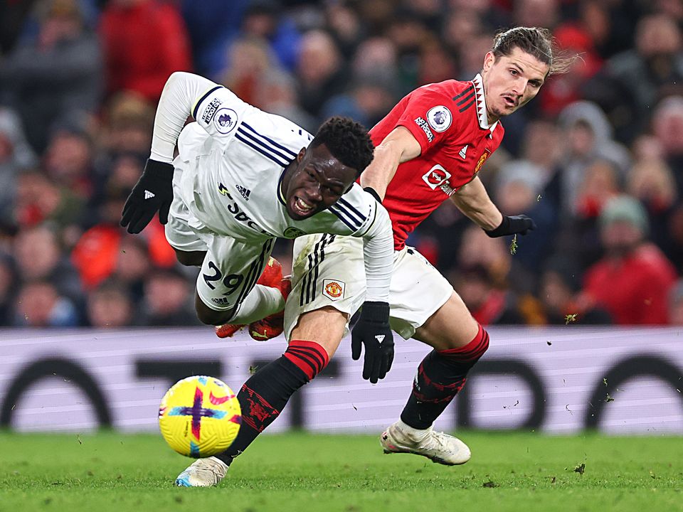 Marcel Sabitzer of Manchester United tackles Wilfried Gnonto of Leeds United. Photo: Robbie Jay Barratt - AMA/Getty Images