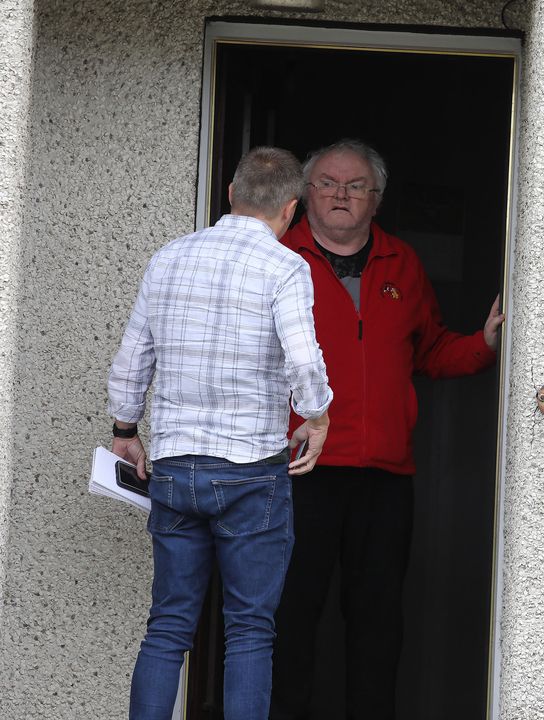 Reporter Steven Moore, comforts former Eucharistic Minister Bernard McNamee, who was recently found guilty of historic sexual abuse of a friends child