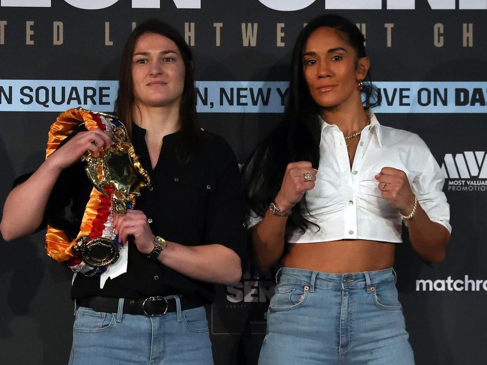 Katie Taylor with her belts and Amanda Serrano