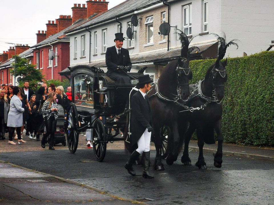 Kevin ‘Maxi’ McAlorum’s funeral cortege makes its way through north Belfast on Friday