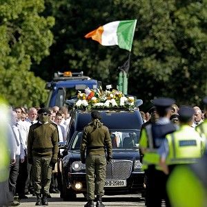 Mourners attending the funeral of Alan Ryan in Dublin