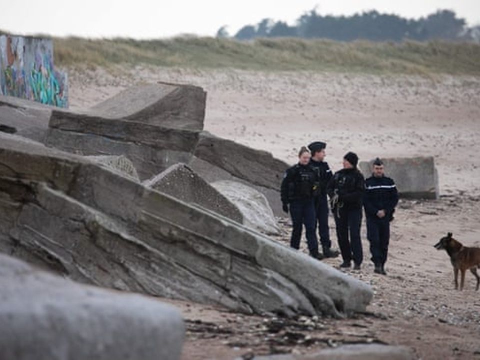 Gendarmes patrol the beach in Néville-sur-mer in north-western France after the drugs washed ashore. Photograph: Lou Benoist/AFP/Getty Images