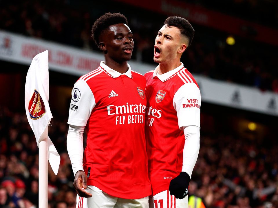Bukayo Saka of Arsenal celebrates with team-mate Gabriel Martinelli 