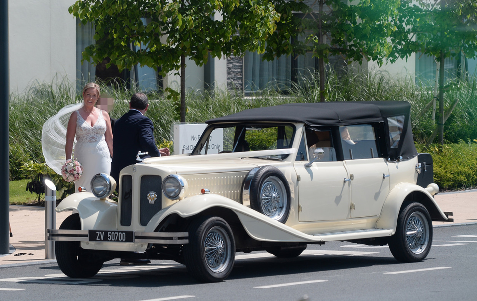Bride Claire Dollard poses for pictures