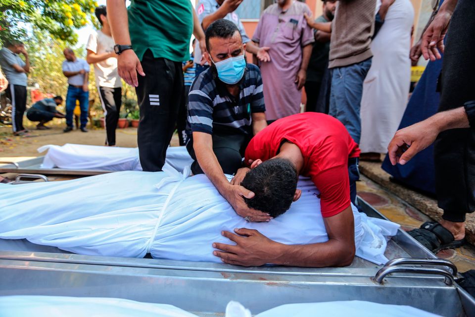People mourn as they collect the bodies of Palestinians killed in Israeli air strikes in Khan Yunis, Gaza, on November 5. Photo by Ahmad Hasaballah/Getty Images