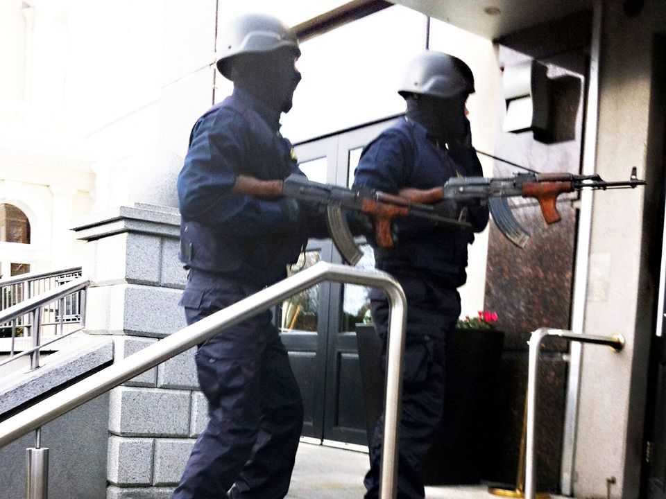 Raiders disguised as Garda armed with AK47 Assault Rifles enter the front door of The Regency Hotel