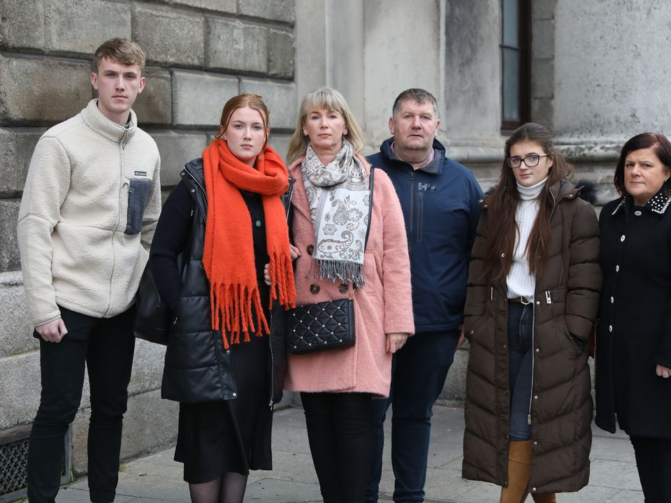 Lillie Collins (peach jacket) sister of Patrick Doyle who sued the HSE on behalf of her brother Patrick Doyle following his death. Pictured with the extended Doyle family outside the Four Courts Photo: Collins Courts