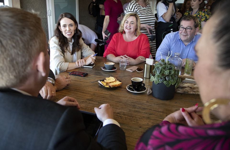 New Zealand Prime Minister Jacinda Ardern and colleagues at their morning-after gathering at a cafe (Mark Baker/AP)