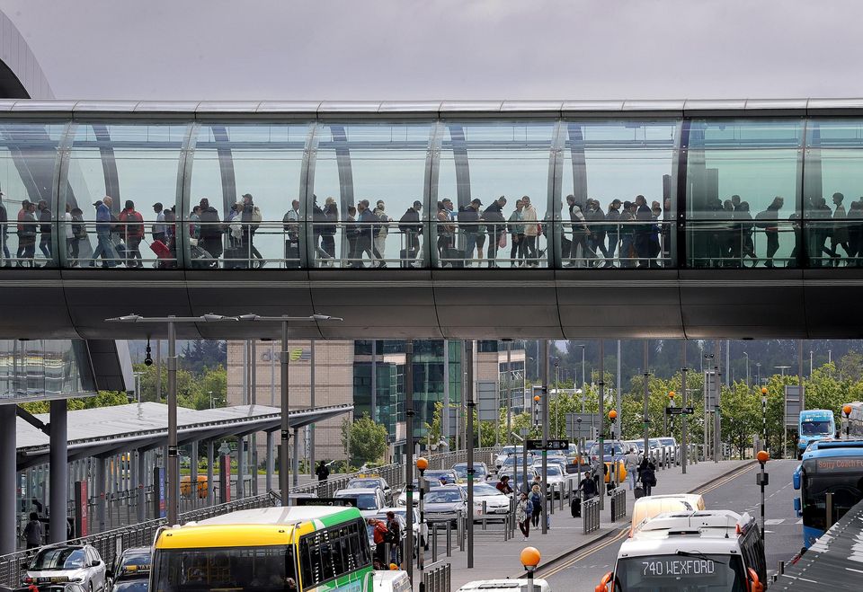 Passengers queue in the walkway into departures at Terminal 2 at Dublin Airport. Photo: Frank McGrath.
