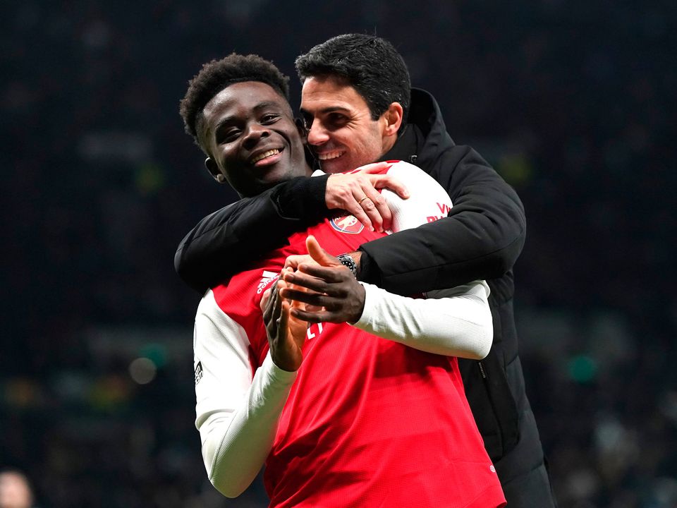 Arsenal's Bukayo Saka (left) celebrates with manager Mikel Arteta following victory over Tottenham. Photo: Nick Potts/PA Wire.