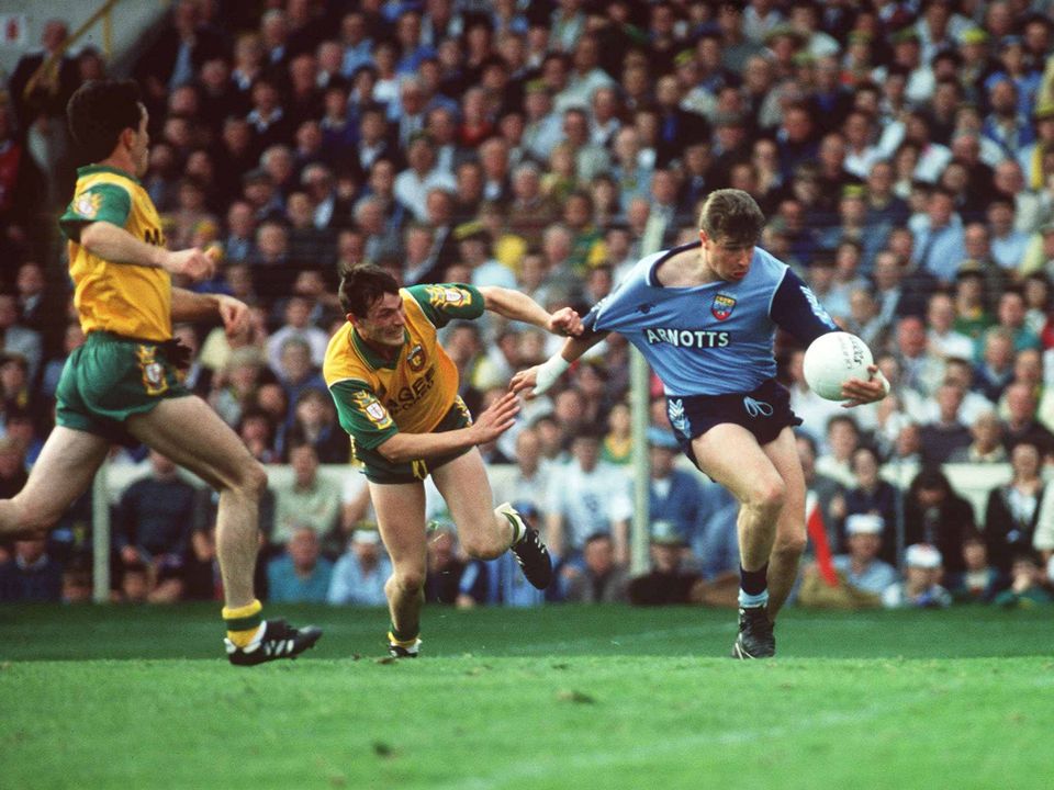 20 September 1992; Charlie Redmond of Dublin is tackled by JJ Doherty of Donegal during the All-Ireland Senior Football Championship Final between Dublin and Donegal at Croke Park in Dublin. Photo by David Maher/Sportsfile