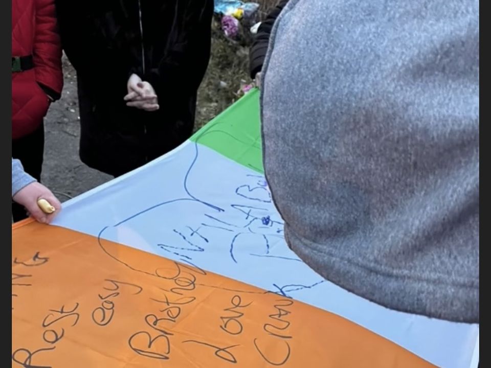 People sign the flag