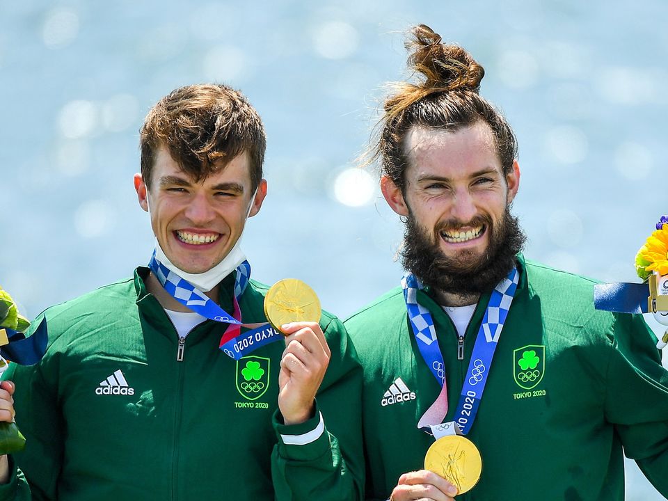 Fintan McCarthy, left, and Paul O'Donovan celebrate with their Olympic gold medals. Photo by Seb Daly/Sportsfile