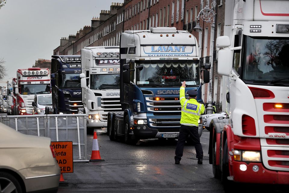 A Garda directs drivers from The Irish Truckers and Haulage Association Against Fuel Prices during their protest at Merrion Square in Dublin in November. Picture:Frank McGrath