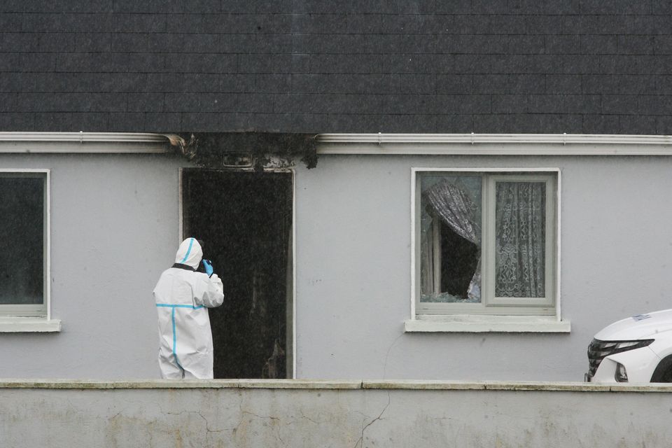 Investigators examine the house at which John Brogan was found dead, at Pheasanthill, Castlebar, Co Mayo. Photo: Padraig O'Reilly