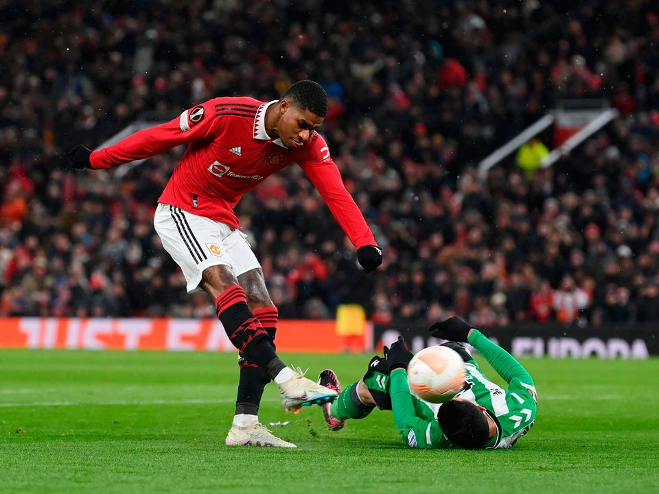 MANCHESTER, ENGLAND - MARCH 09: Marcus Rashford of Manchester United scores the team's first goal during the UEFA Europa League round of 16 leg one match between Manchester United and Real Betis at Old Trafford on March 09, 2023 in Manchester, England. (Photo by Michael Regan/Getty Images)