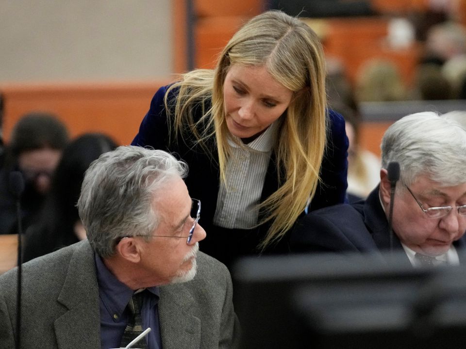 Gwyneth Paltrow speaks with retired optometrist Terry Sanderson as she walks out of the courtroom following the reading of the verdict. Photo: Reuters