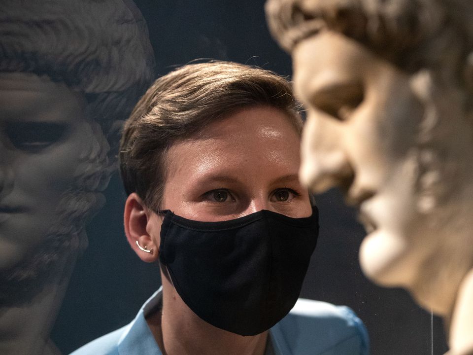 Project curator Francesca Bologna inspects a marble bust of Nero (Andrew Matthews/PA)