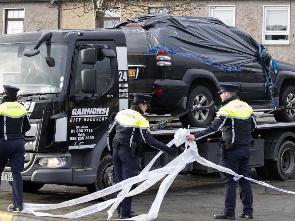 A vehicle is removed is removed from the scene this morning of a fatal shooting in which a man in his 20's was shot in the driveway of a house. Picture: Colin Keegan, Collins Dublin