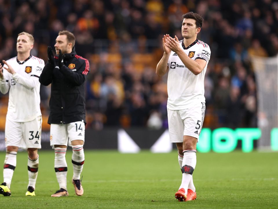 WOLVERHAMPTON, ENGLAND - DECEMBER 31: Donny van de Beek, Christian Eriksen and Harry Maguire of Manchester United applaud their fans after the Premier League match between Wolverhampton Wanderers and Manchester United at Molineux on December 31, 2022 in Wolverhampton, England. (Photo by Naomi Baker/Getty Images)