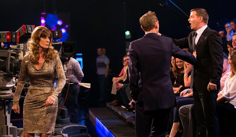 Tubridy stands between Billy McGuinness and Linda Martin during a furious row