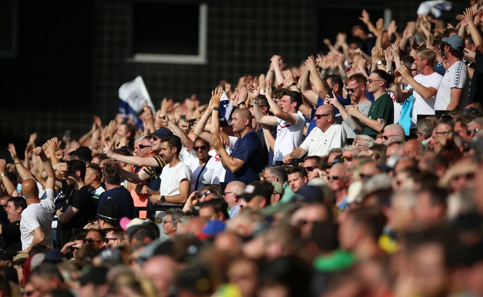 Tottenham fans at Carrow Road celebrated a big win (Nigel French/PA)