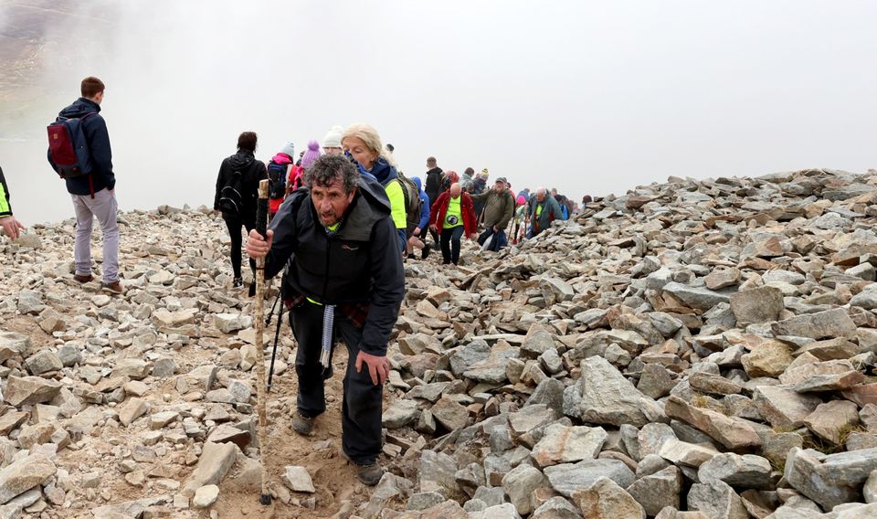 Charlie Bird makes his way to the top of Croagh Patrick. Picture; Gerry Mooney.