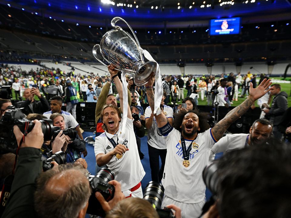 Luka Modric and Marcelo of Real Madrid celebrate with the UEFA Champions League trophy after their side's victory over Liverpool in the final last May. Photo by David Ramos/Getty Images