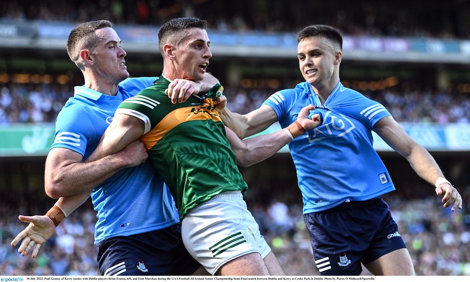 Paul Geaney of Kerry tussles with Dublin players Brian Fenton, left, and Eoin Murchan 