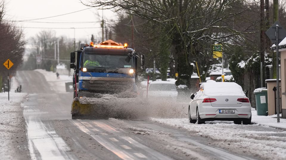 A snow plough and gritting lorry in Ballylynan in County Laois, Ireland (Niall Carson/PA)