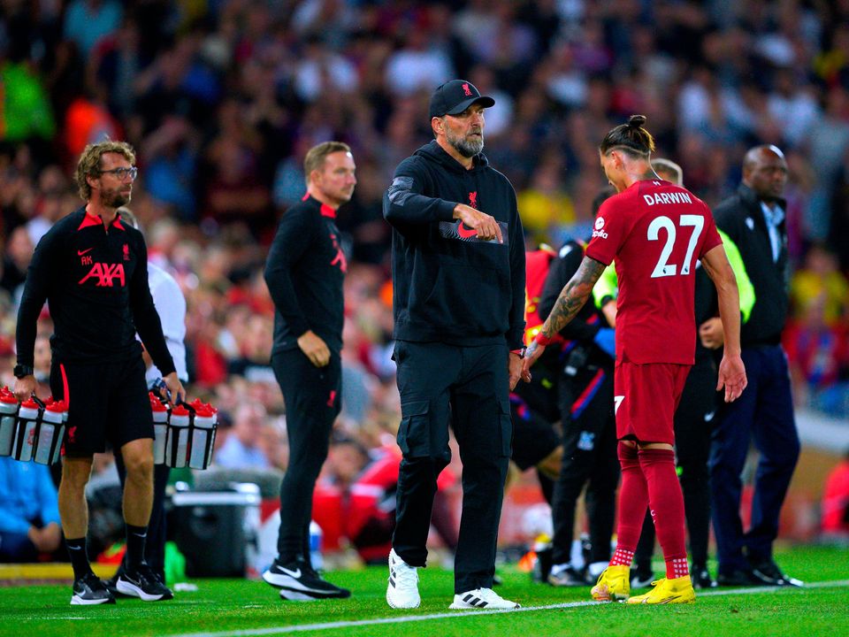 Liverpool's Darwin Nunez (right) walks past manager Jurgen Klopp as he leaves the pitch after receiving a red card: Peter Byrne/PA Wire