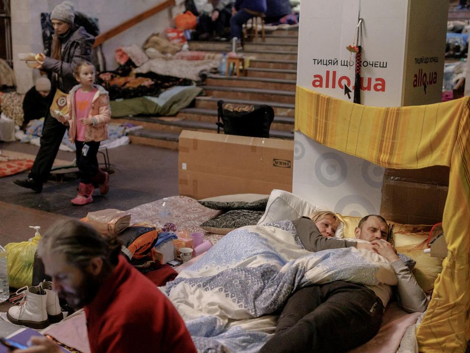 People shelter from shelling in a metro station in their neighbourhood in northern Kharkiv as Russia's attack on Ukraine continues. Photo: Reuters/Thomas Peter