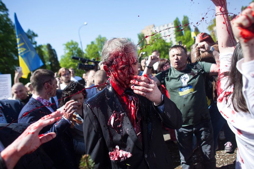 Russian Ambassador to Poland, Ambassador Sergey Andreev is covered with red paint in Warsaw, Poland. Photo: Maciek Luczniewski/AP