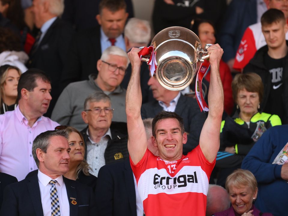 Benny Heron lifts the Anglo-Celt Cup after Derry's victory in the Ulster SF Final. Photo: Stephen McCarthy/Sportsfile