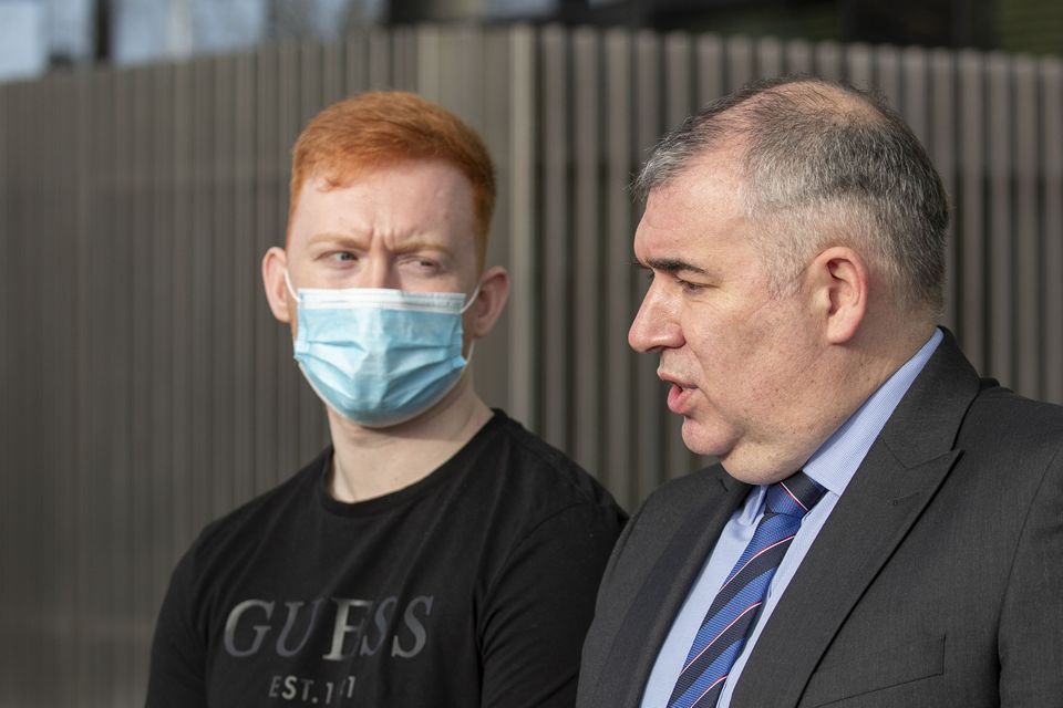Adam Ward (left) outside court with Detective Sergeant Seán Cosgrove yesterday after his father, Alan Ward was sentenced to life in prison for the murder of Adam’s mother, Catherine Doyle
